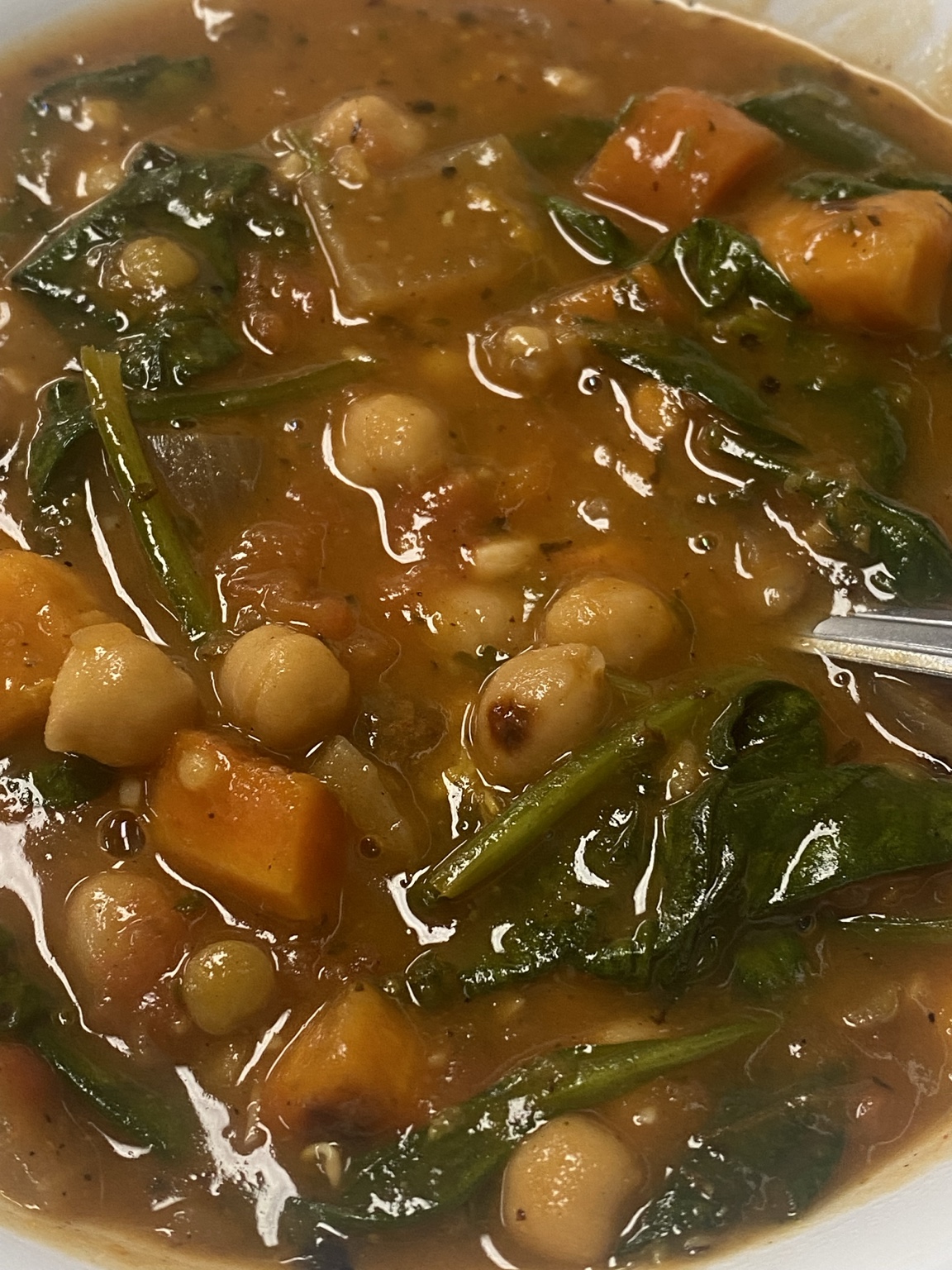 Chickpea, sweet potato, and spinach stew prepared by Gaetano Mazza